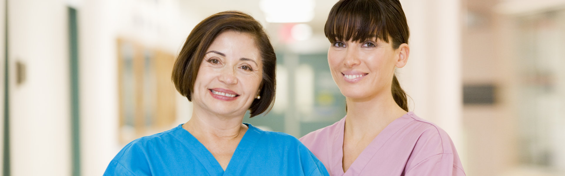 two nurse looking at the camera